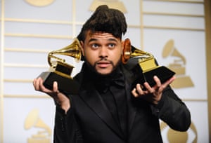 The Weeknd poses in the press room after winning two awards for Best R&amp;B Performance and Best Urban Contemporary Album