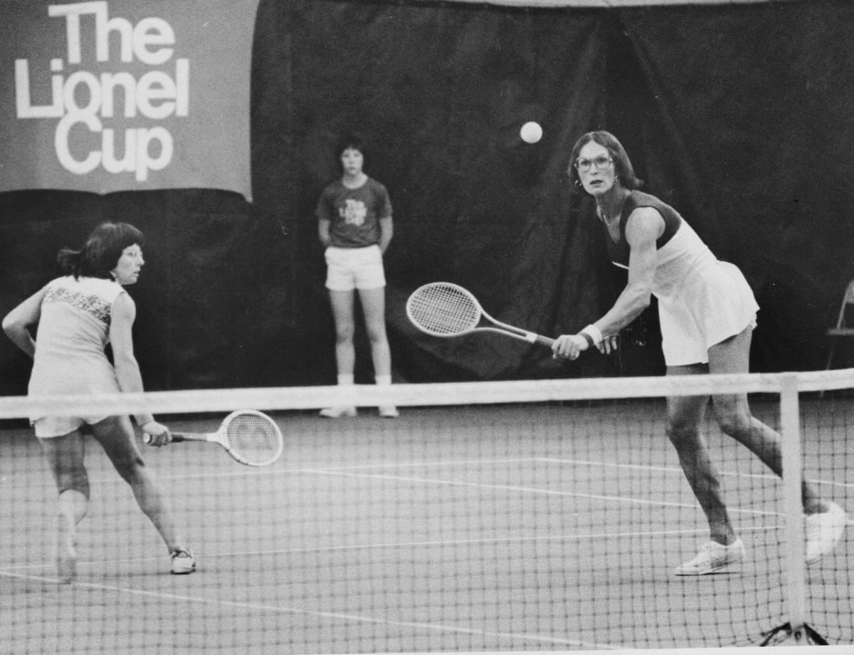 A black and white photo of Billie Jean King and Renée Richards playing a doubles match.
