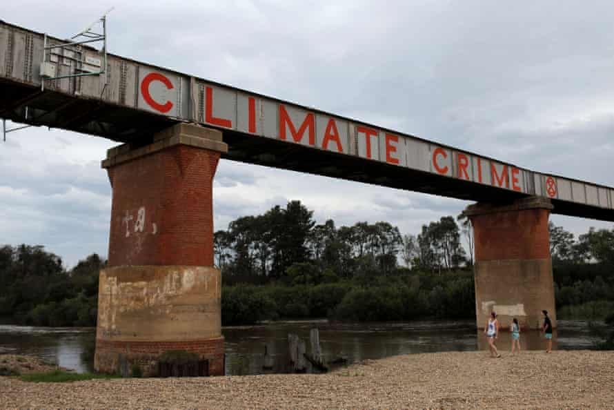 A climate protest painted on a bridge over the Avon River in the Gippsland town of Stratford in Victoria