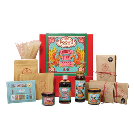 Hamper box with various products in front of it