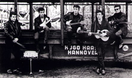The Beatles in an early shot by Kirchherr; L-R: Pete Best, George Harrison, John Lennon, Paul McCartney, Stuart Sutcliffe - posed at Hamburg funfair.