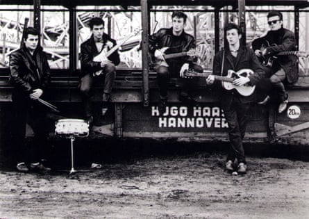 Pete Best, George Harrison, John Lennon, Paul McCartney and Stuart Sutcliffe pose at Hamburg Funfair.