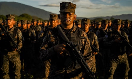 Soldiers look on as Bukele speaks in San Juan Opico in November 2022.