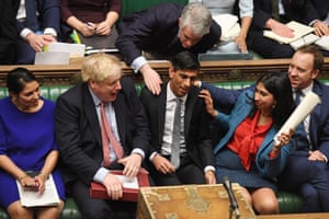 Pats on the back for Chancellor Rishi Sunak, after delivering his Budget in the House of Commons, 11 March