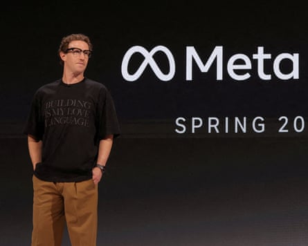 Zuckerberg on stage wearing the glasses and a shirt that reads “building is my love language”