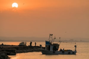 A fishing boat and fishermen at Sinop, Turkey