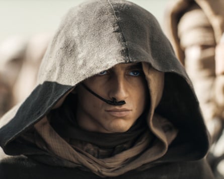 man in hood looks ahead