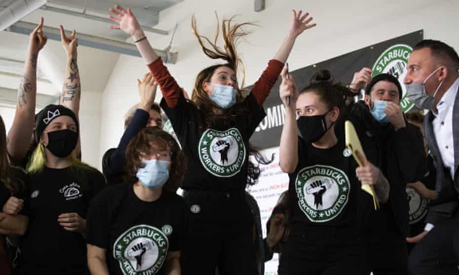 Starbucks employees and supporters react as votes are read during a viewing of their union election on Thursday, Dec. 9, 2021, in Buffalo, N.Y. Starbucks workers at a Buffalo store voted to unionize on Thursday, a first for the 50-year-old coffee retailer in the U.S. and the latest sign that the labor movement is stirring after decades of decline. (AP Photo/Joshua Bessex)