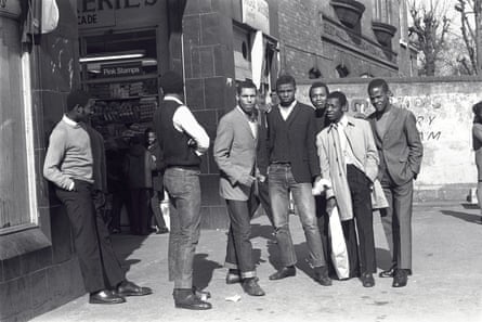 Kenlock’s childhood friends meet near a Brixton market. c1975