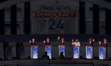 Most of the candidates on stage raised their hands to say they’d support Donald Trump as the Republican nominee.