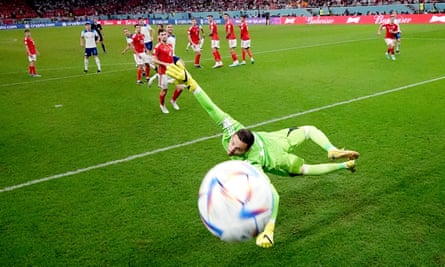 Marcus Rashford’s escaped footwear goes past Wales’ Danny Ward.