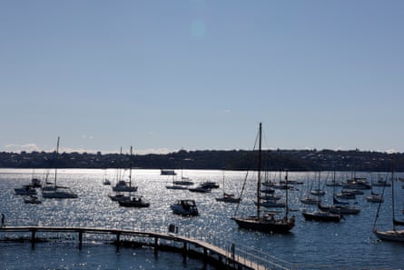 Boats bob on Sydney Harbour just beyond Murray Rose Pool.