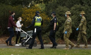 ADF personnel and Victorian police officers are seen patrolling the Botanic Gardens in Melbourne, Sunday, 26 July 2020.