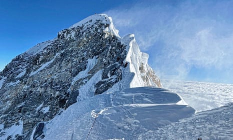 Climbers ascending the south face of Everest reach the Hillary Step near the summit