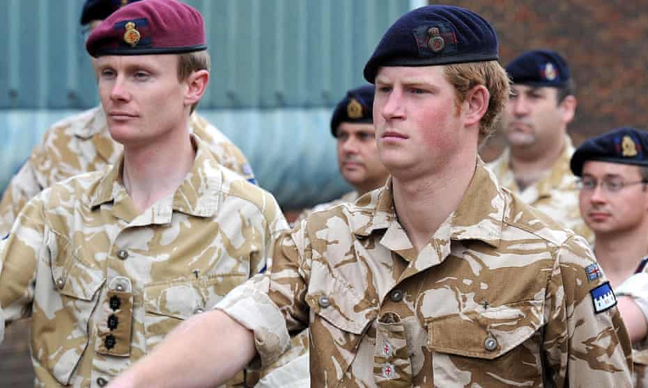 Prince Harry (right) marches before receiving a campaign medal for his army service in Afghanistan in 2008