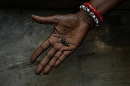 Seeds in the palm of a black woman’s hand