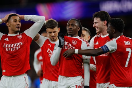 Eberechi Eze of Arsenal (centre) celebrates scoring his team's first goal with teammates.