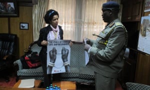 Paula Kahumbu delivers posters and presents a petition demanding the arrest of suspected ivory trafficker Feisal Mohamed Ali letter to the Inspector General of Police, David Kimaiyo, at his Nairobi office, 12 August 2014