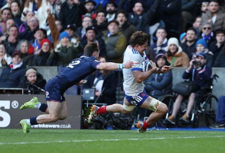 France's Oscar Jegou scores their fifth try.