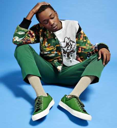 Ashton Sanders, star of Moonlight film, against a blue background