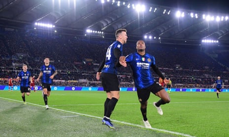 Denzel Dumfries leads the celebrations after scoring Inter’s third goal before half-time of a dominant win at Roma. 