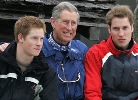 Prince Charles, with his sons Harry and William, grits his teeth during a media photocall in Monbiel during their annual skiing holiday