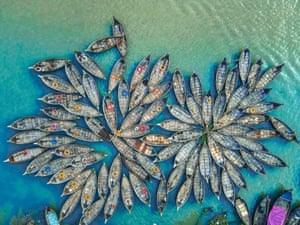 Dhaka, BangladeshWooden boats resemble flowers in Buringanga river Port as they fan out around their moorings.