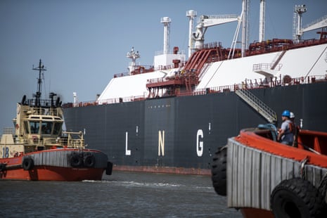 Tug boats prepare to pull out a liquefied natural gas tanker ship in Cameron, Louisiana, in April 2022.