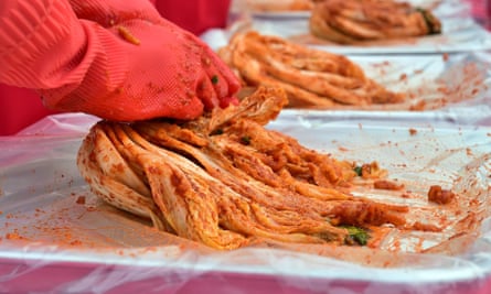 People take part in a kimchi making event in Seoul.