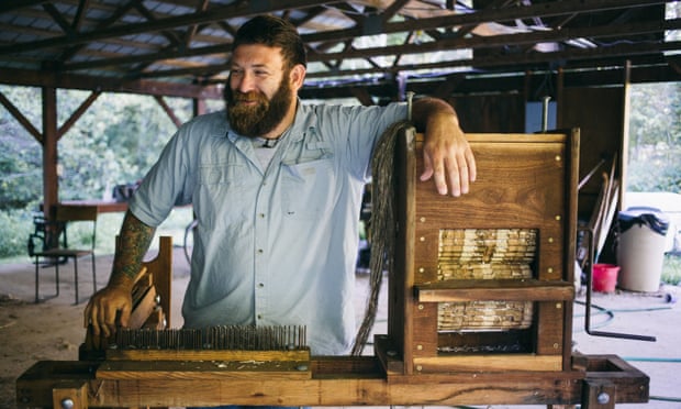 Michael Lewis with his special, one-of-a-kind hemp processing machine, called a break.