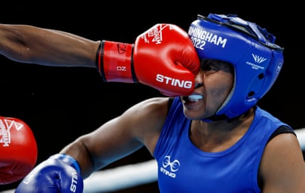 Natasha Maya of Malawi gets hit in the face as she loses her round of 16 match against Keamogetse Kenosi of Botswana in the women’s featherweight boxing.