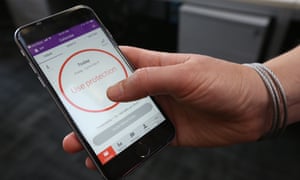 A women demonstrates using the Natural Cycles smartphone app