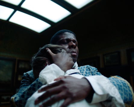 A person embracing another in a scene from a film