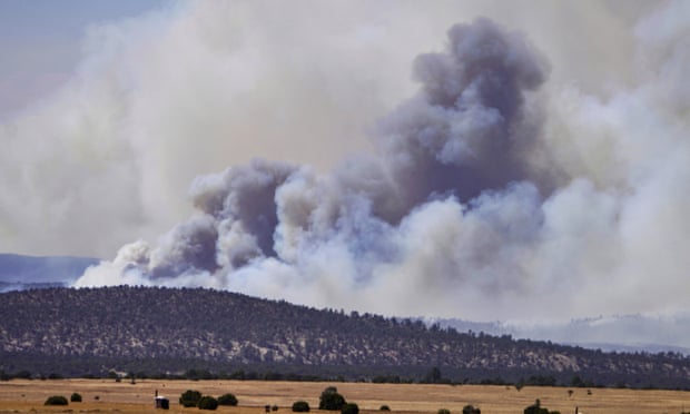 Smoke rises from wildfires near the town of Las Vegas, New Mexico.