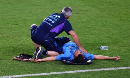 Nicolás Tagliafico receives treatment during training for Argentina in Doha.