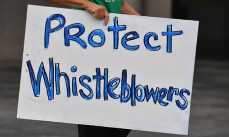Placard saying 'protect whistleblowers'