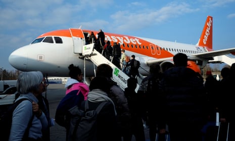 Passengers board the easyJet aircraft from Berlin to Geneva at Schoenefeld airport.