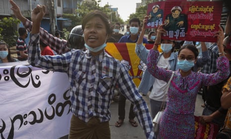 Demonstrators march during an anti-military coup protest in Mandalay, Myanmar, on Wednesday.