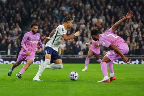 Dominic Solanke dribbles past Coventry defenders during a Premier League match