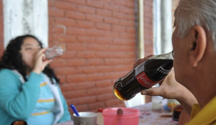 Two people drink sugary drinks