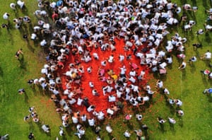 Aerial view of people participating in the tenth annual Tomato Fight Festival