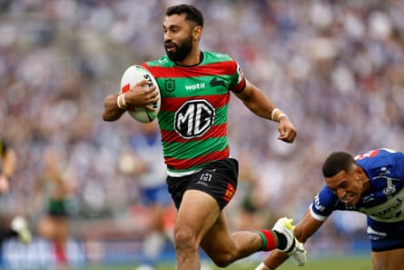 Alex Johnston runs with the ball for South Sydney Rabbitohs