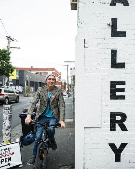 James Norman on a bike outside a gallery