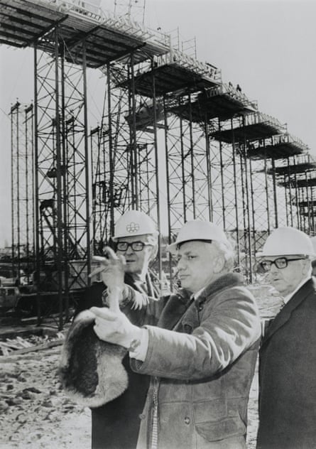 Governor general Jules Leger (left) and mayor Jean Drapeau (right), listen as Roger Taillibert describes the layout of Parc Olympique.