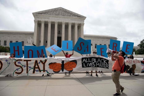 Activists hold a banner in front of the US Supreme Court in Washington, DC, on June 18.