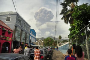 Volcanic ash covers St Vincent – in pictures 12 People look at the erupting volcano