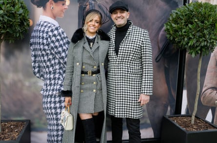 Sophie Hall and Jordan Wylie pose in houndstooth outfits