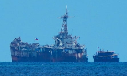 A Philippine supply boat reaches the BRP Sierra Madre during a rotation and resupply mission at the Second Thomas Shoal.