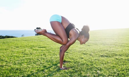 A woman doing the crow pose