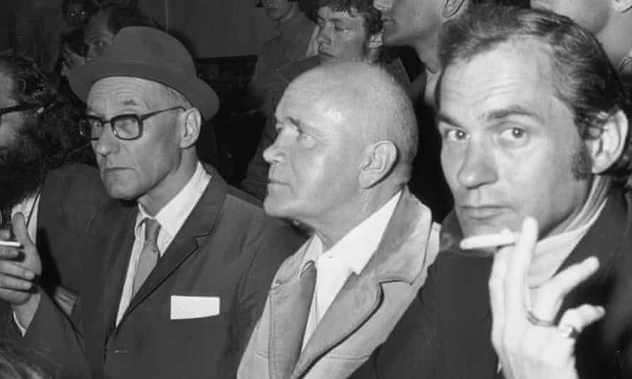 Jean Genet (middle) sitting next to William S Burroughs on a visit the US in the 1960s.